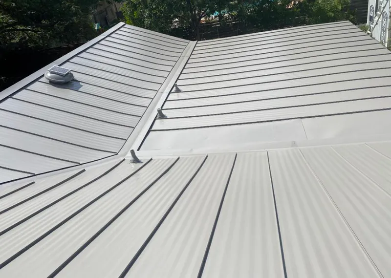 Solar attic fan installed on a metal roof for Roof Ventilation in Merrydale